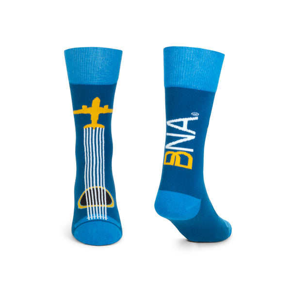 Front and Back views of BNA Airplane Guitar Socks.  Front features airplane guitar design with strings of guitar coming from tail of plane over the guitar sound hole.  Back features BNA logo in gold and white.  Cuffs, heels, and toes are bright blue.