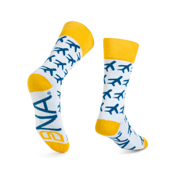White socks with blue allover airplane pattern and gold cuffs, heel, and toe.  Features large BNA logo (gold infinity B and blue NA) on the sole.