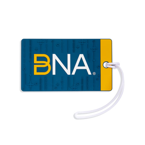 Soft silicone luggage tag in blue with matching tonal airplane pattern.  Trimmed in yellow and features the BNA logo centered.