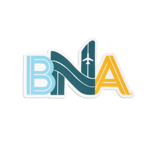 Die-Cut sticker featuring a stylized BNA made to appear like airfield runways.  An aircraft is viewed on the N.  Each letter is a differet color; the B is pale blue, N is a dark teal, and A a sunflower yellow.