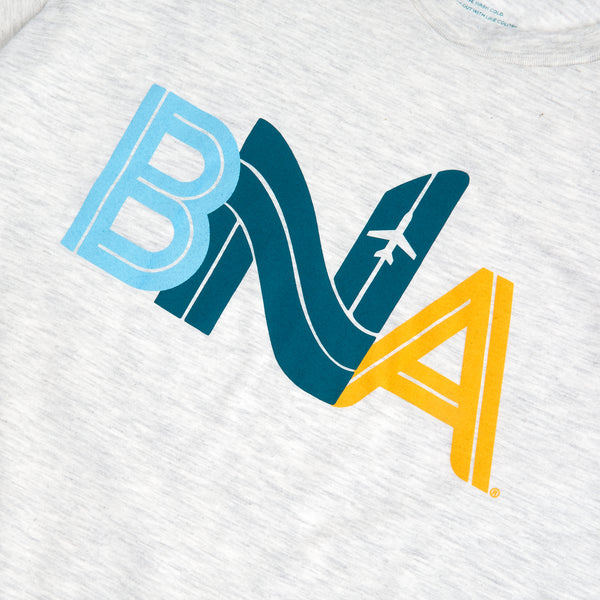 Detail view of light gray heather unisex t-shirt featuring a BNA made to appear like airfield runways. An aircraft is viewed on the N. Each letter is a differet color; the B is pale blue, N is a dark teal, and A a sunflower yellow.