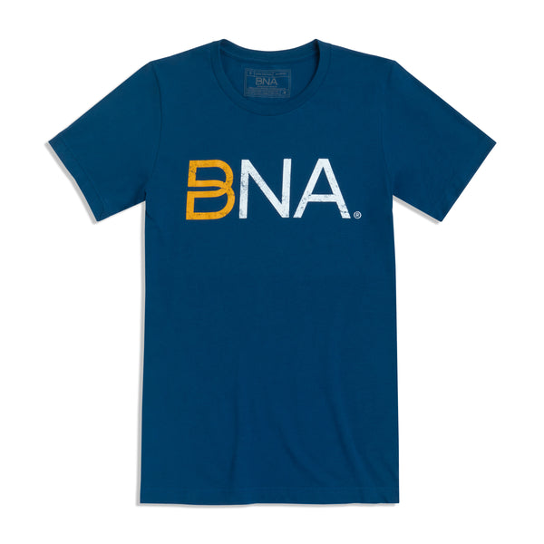 Blue t-shirt with lightly distressed 'BNA' logo in yellow and white centered on the chest.  BNA logo features a unique infinity "B."