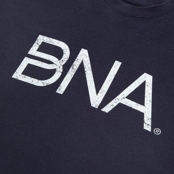 detail view of white distressed BNA logo screenprint on navy blue sweatshirt.