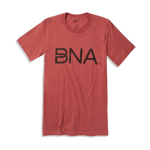 Rust colored unisex t-shirt featuring black distressed BNA logo on center of chest.